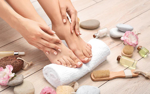 A lady's foot taken care of using foot care essentials from Haile Cozzie Soles