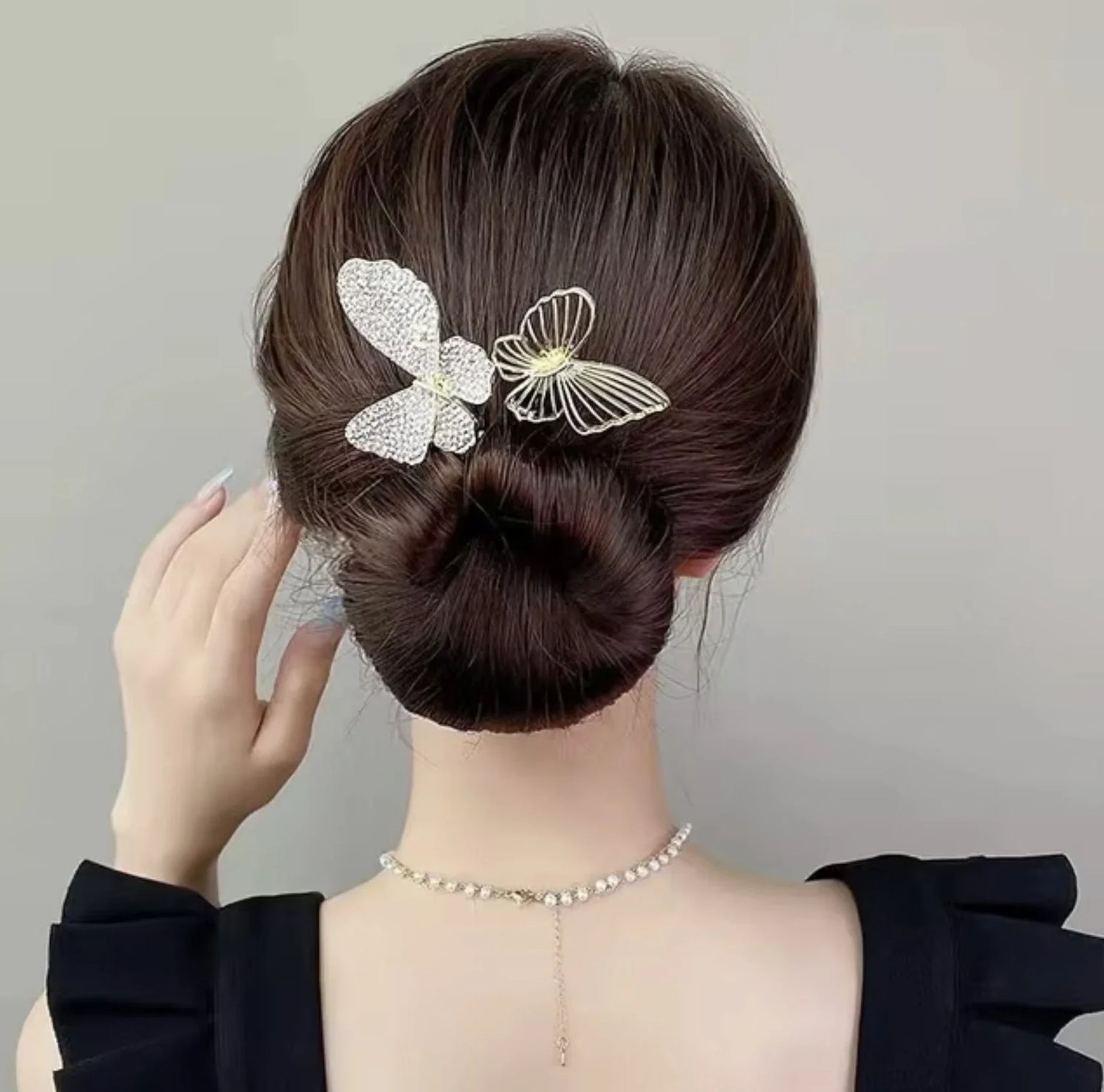 A woman wearing a pretty hairclip from Haile Cozzie Soles