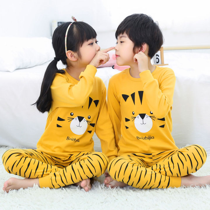 A sibling wearing a matching cute pajama sets