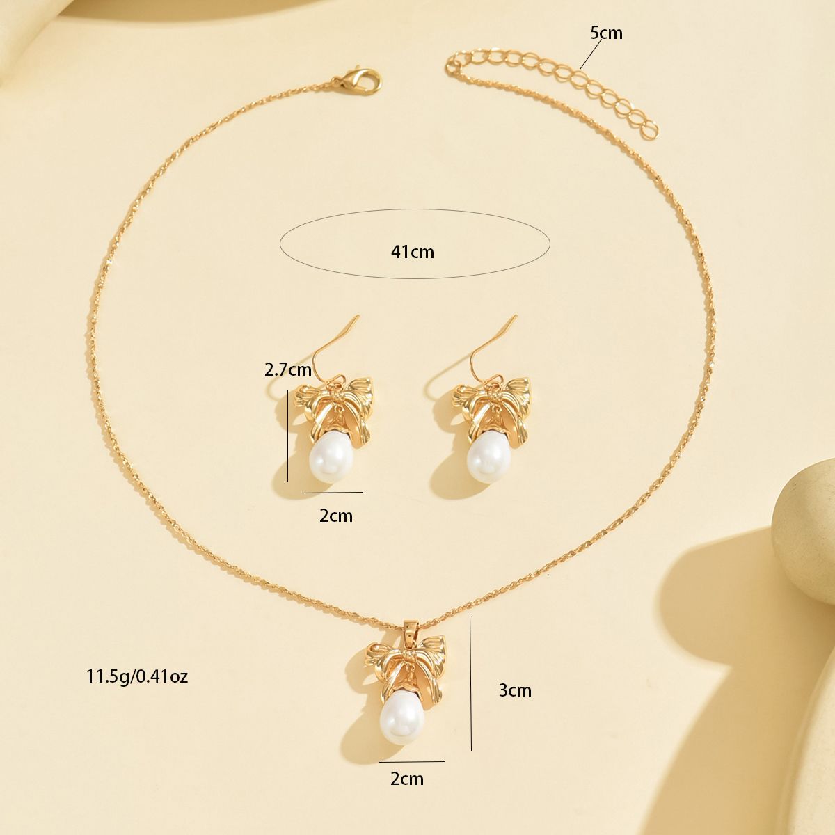 Elegant Gold-Toned Bow & Pearl  Jewelry Set - Necklace & Earrings